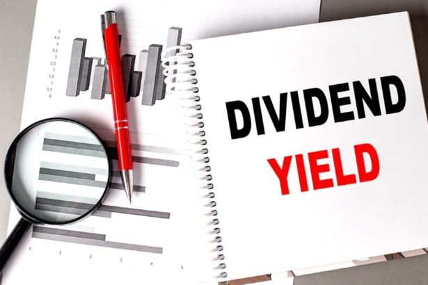DIVIDEND YIELD text written on a notebook with chart