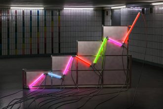 A graph made of neon tubes in a room