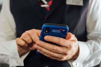 British Airways cabin crew with mobile device