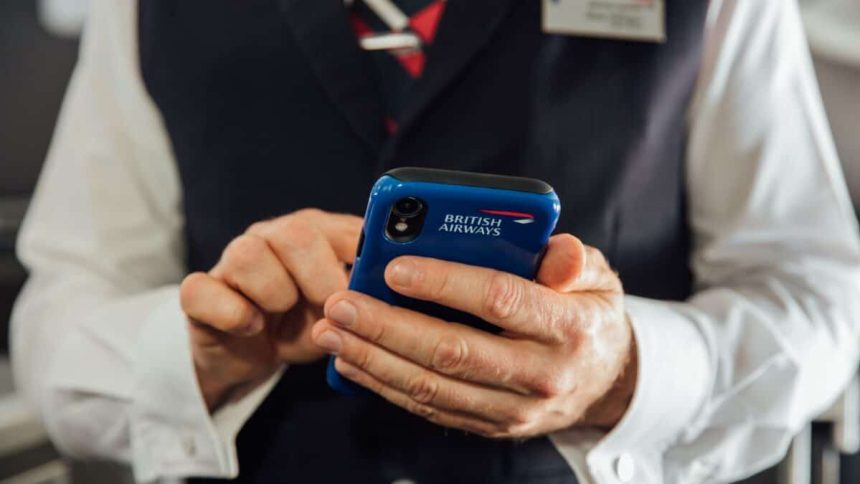 British Airways cabin crew with mobile device