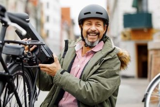 Man changing battery on electric bicycle